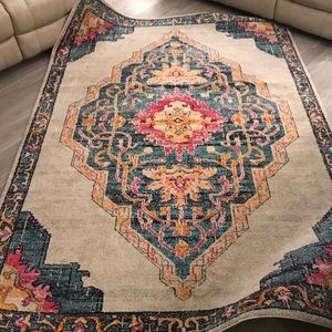 Multicolor 6’7 X 9’2 area rug from Rooms To Go.